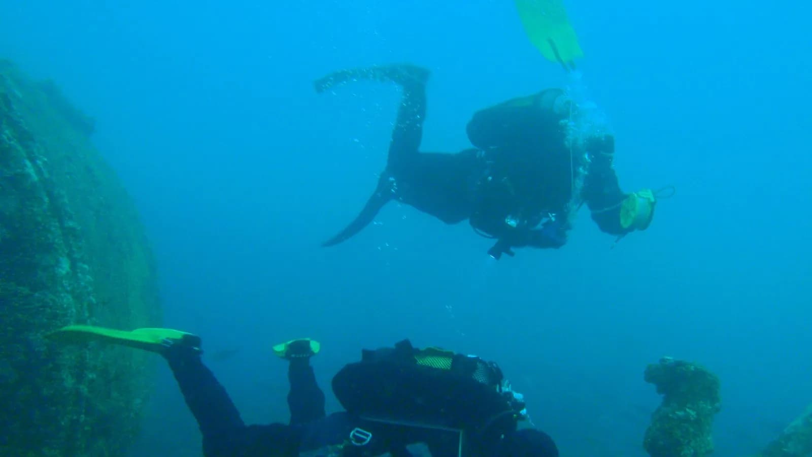 A scuba diver at the surface in open water