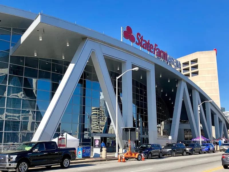 The glass front and white steel struts of State Farm Arena in downtown Atlanta under a clear sky, with the State Farm Arena sign above the entrance and cars parked along the street, photographed on 22 March 2019, a file photograph of the venue and not of Thursday's Game 6