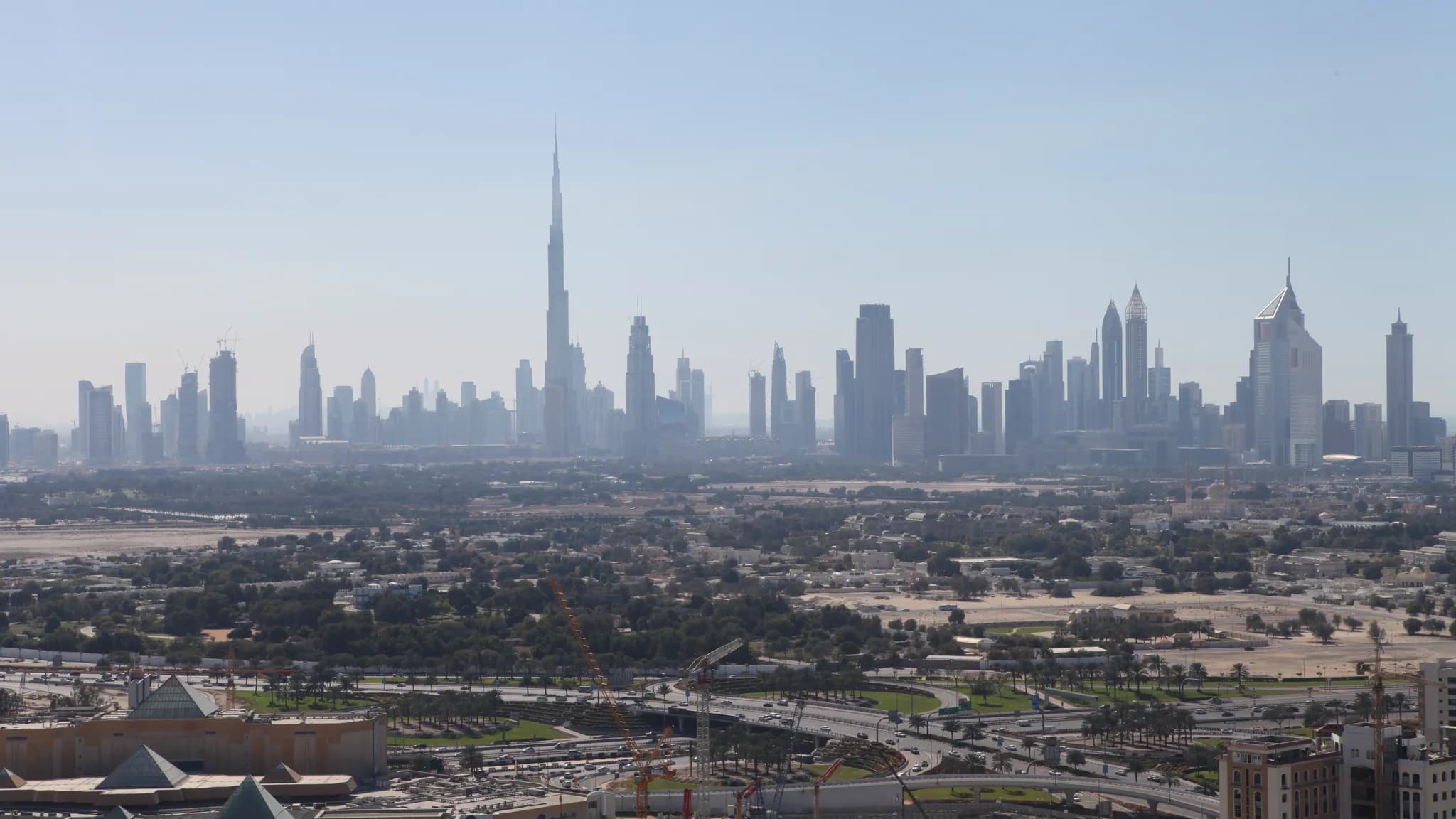 Visitors looking across Dubai's skyline during the summer travel season