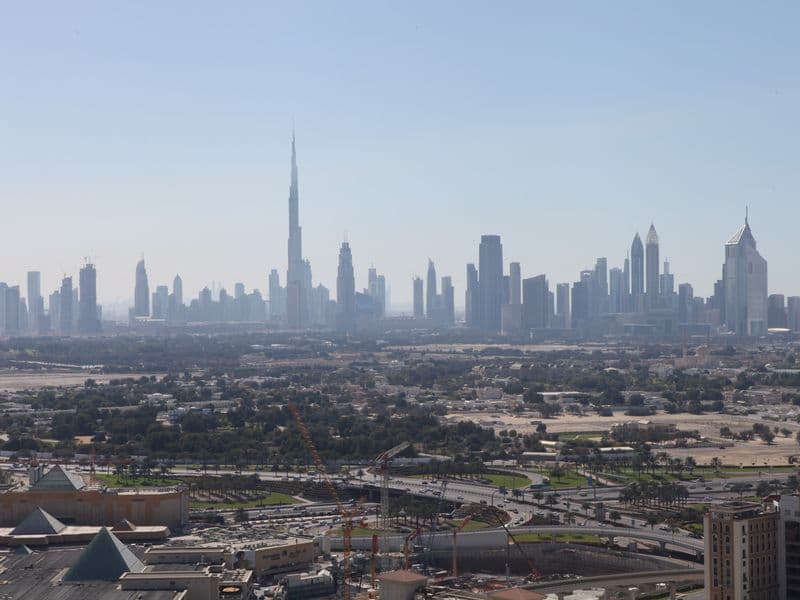 Visitors looking across Dubai's skyline during the summer travel season