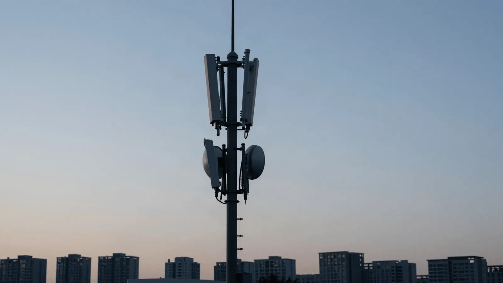 A telecommunications mast against an open sky