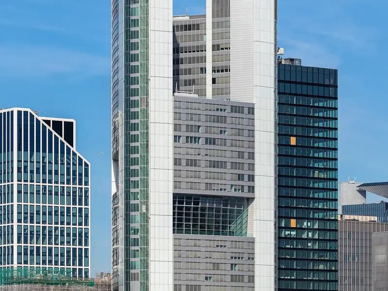 The Commerzbank Tower in Frankfurt rising above neighbouring office buildings under a blue sky, photographed on 10 July 2019, a file photograph of the German bank's headquarters tower and not from this week