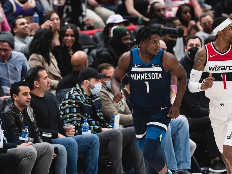 Anthony Edwards of the Minnesota Timberwolves, number 1 in a dark blue jersey, running up court beside a Washington Wizards player in front of courtside spectators, photographed on 1 December 2021, a file photograph of Edwards and not of his surgery or of Thursday night's games