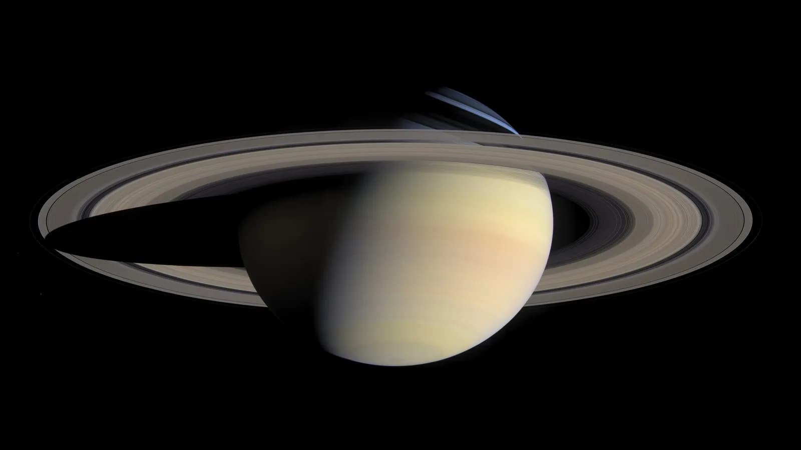 Saturn and its rings photographed by the Cassini spacecraft on 6 October 2004, illustrative of the mission whose archived data was reanalysed and not a new image of Enceladus itself
