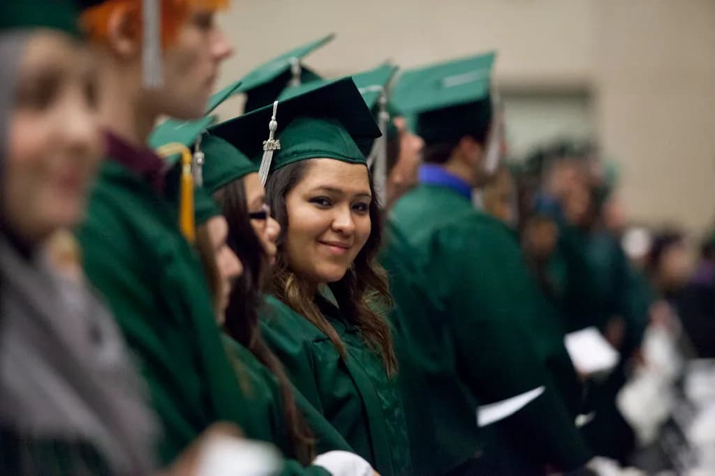 Graduates in caps and gowns at a university ceremony