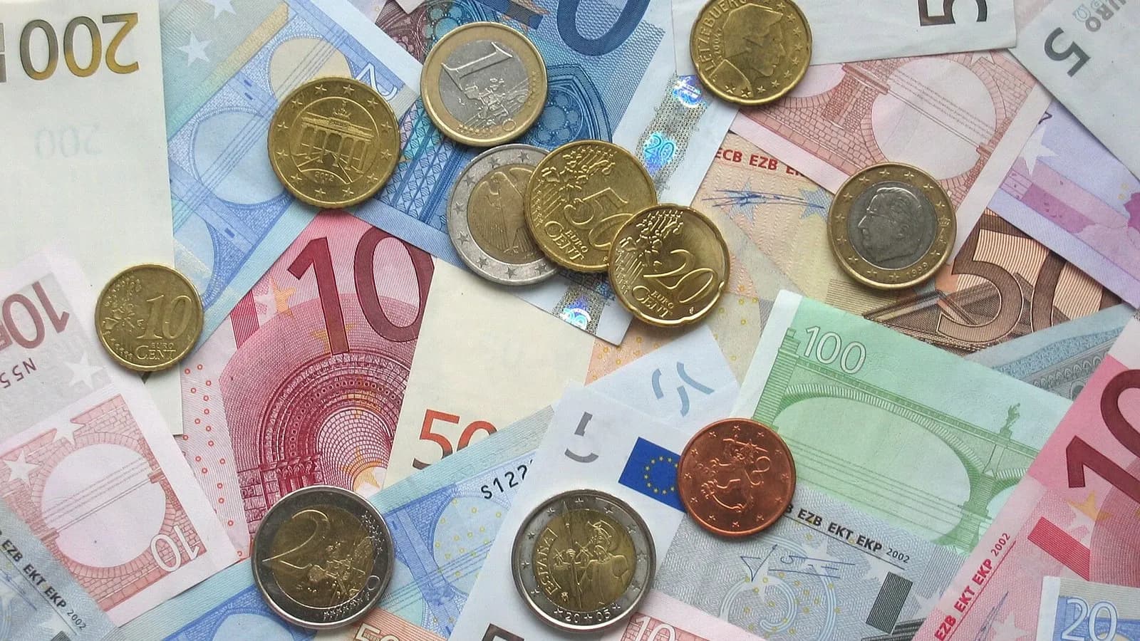 Euro banknotes and coins of several denominations spread on a table, photographed on 14 October 2006, a file photograph illustrative of the euro and not of any stablecoin or of ESMA