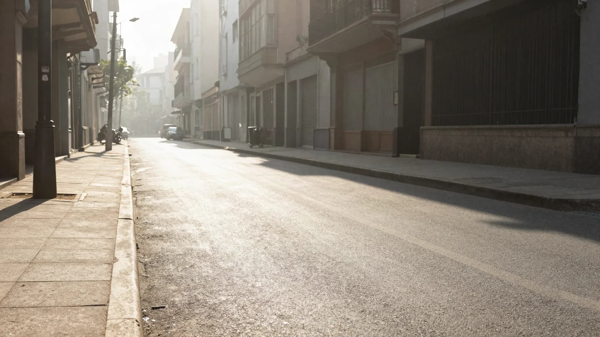 A city street shimmering with heat haze in intense summer sun