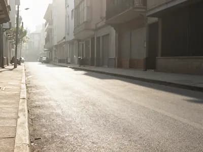 A city street shimmering with heat haze in intense summer sun