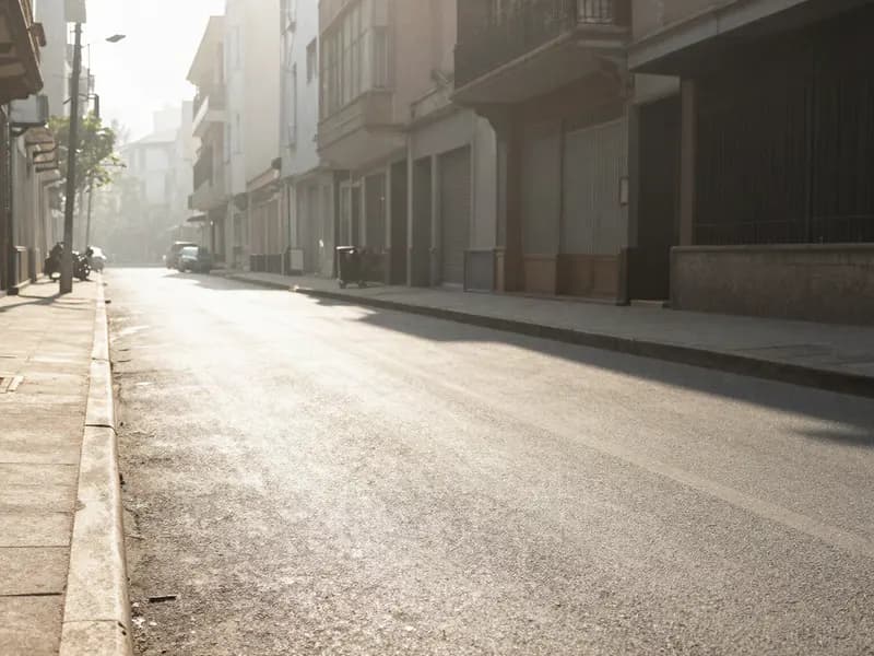 A city street shimmering with heat haze in intense summer sun