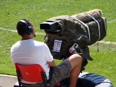 Broadcast cameras overlooking a major football stadium