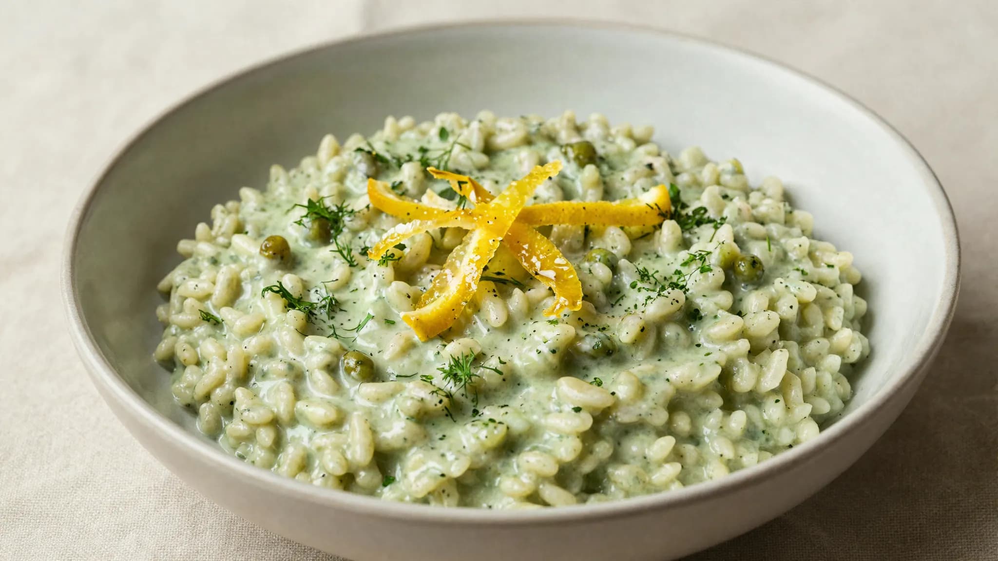 Creamy freekeh risotto topped with preserved lemon