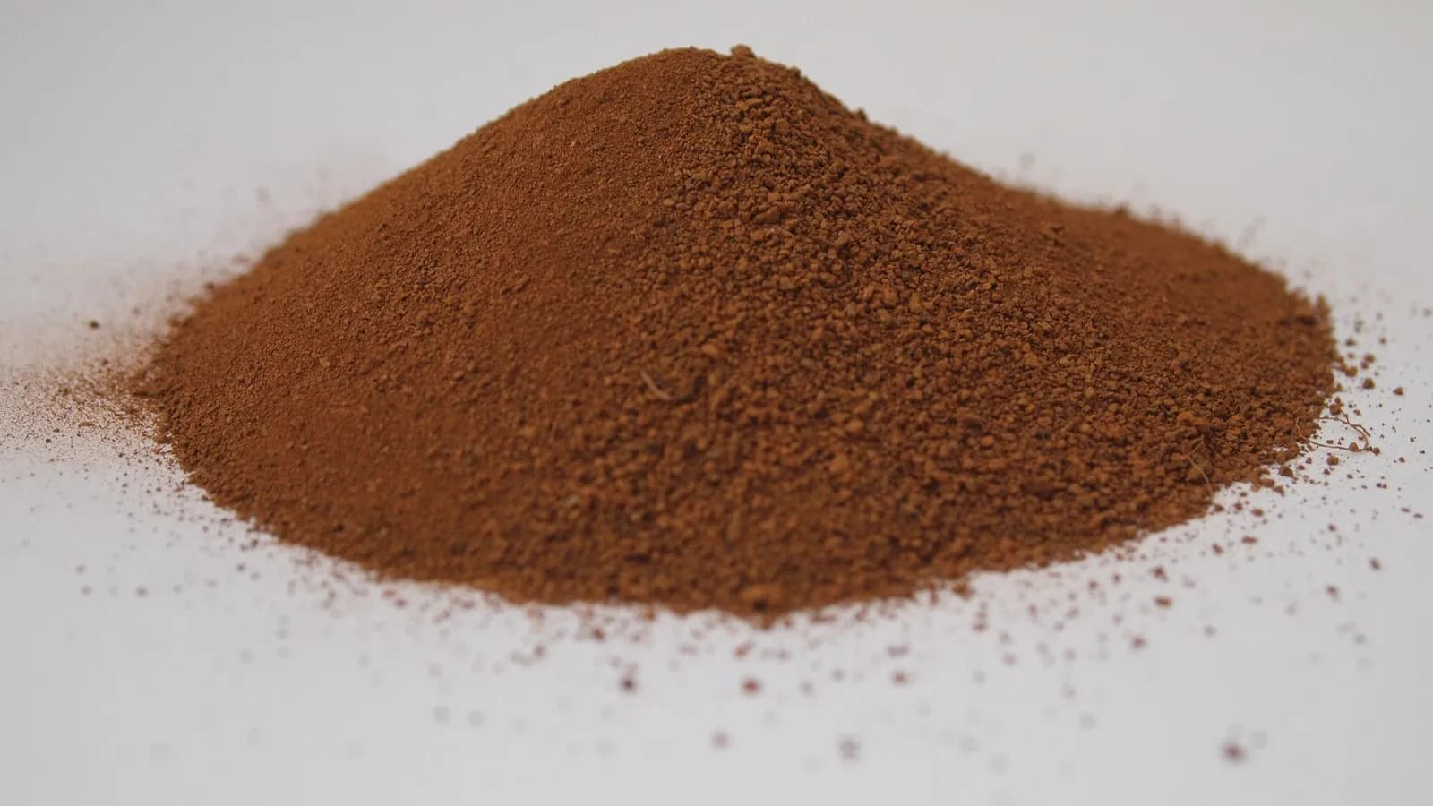 A pile of Martian regolith simulant, the kind of manufactured stand-in material used in the studies this review covers, photographed in April 2014