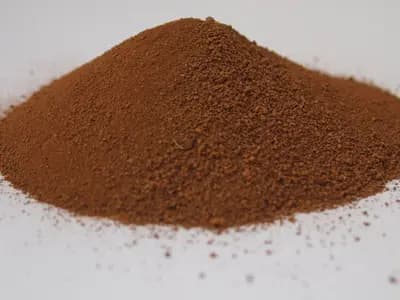 A pile of Martian regolith simulant, the kind of manufactured stand-in material used in the studies this review covers, photographed in April 2014