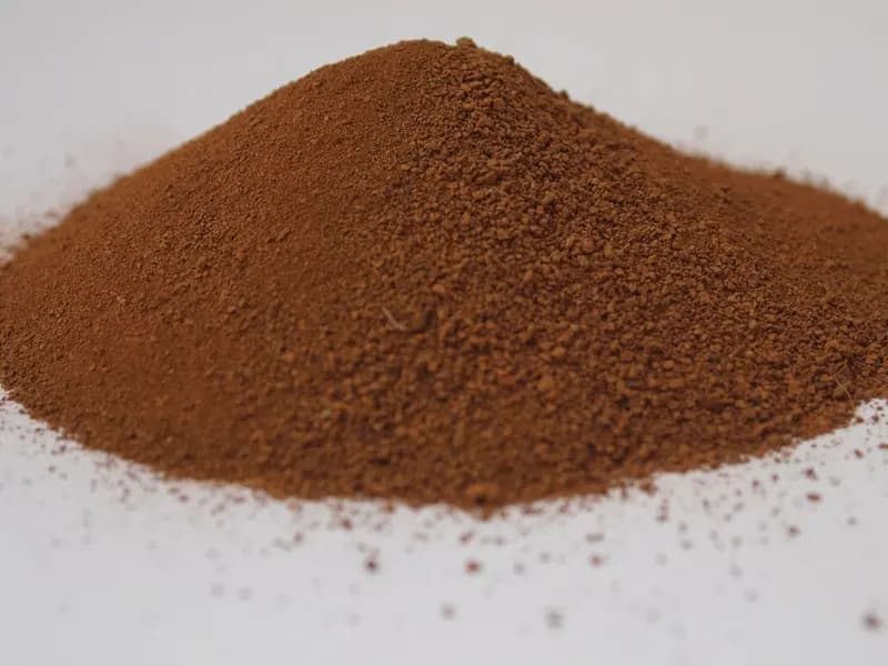 A pile of Martian regolith simulant, the kind of manufactured stand-in material used in the studies this review covers, photographed in April 2014