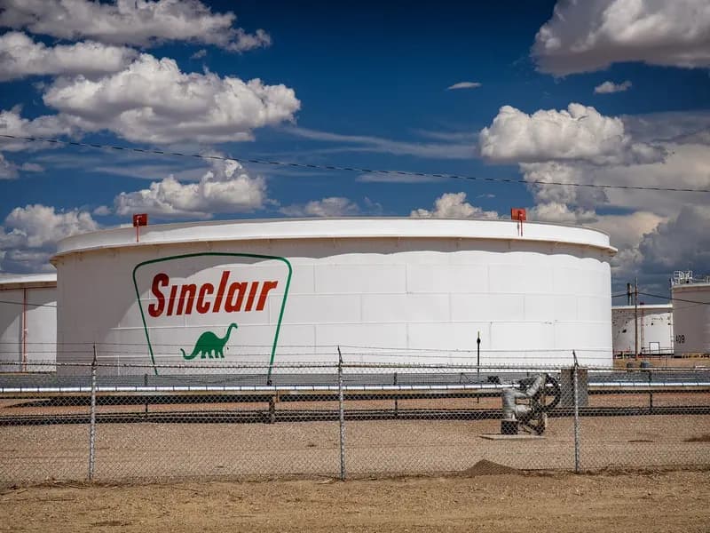 White oil storage tanks at a refinery in Wyoming, a file photograph taken in July 2025 that illustrates fuel storage and is not one of the reserve sites involved in the G7 release
