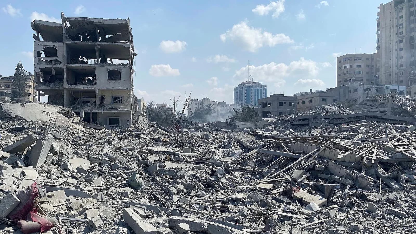 Damaged residential buildings in the Rimal neighbourhood of Gaza City after an airstrike on 9 October 2023, a file photograph illustrative of the destruction the aid groups describe and not taken this week