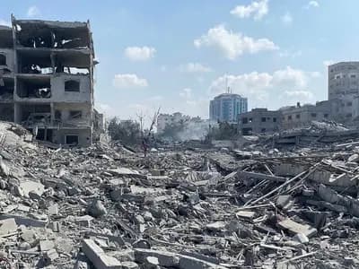 Damaged residential buildings in the Rimal neighbourhood of Gaza City after an airstrike on 9 October 2023, a file photograph illustrative of the destruction the aid groups describe and not taken this week