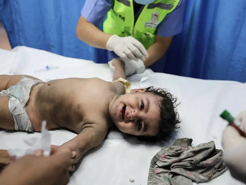 Damage in the Gaza Strip during the war, illustrative of the destruction referenced in the death toll report and not a scene from this week, photographed in October 2023