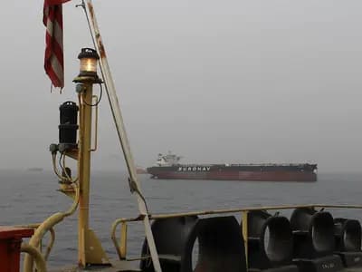 A Euronav oil tanker lying at anchor in haze off Fujairah, United Arab Emirates, seen from the deck of another ship, photographed on 21 March 2012, a file photograph of merchant shipping near the Strait of Hormuz and not of the GFS Pride or the Cape Dao