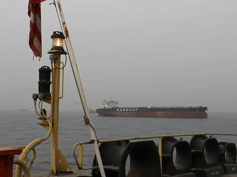 A Euronav oil tanker lying at anchor in haze off Fujairah, United Arab Emirates, seen from the deck of another ship, photographed on 21 March 2012, a file photograph of merchant shipping near the Strait of Hormuz and not of the GFS Pride or the Cape Dao