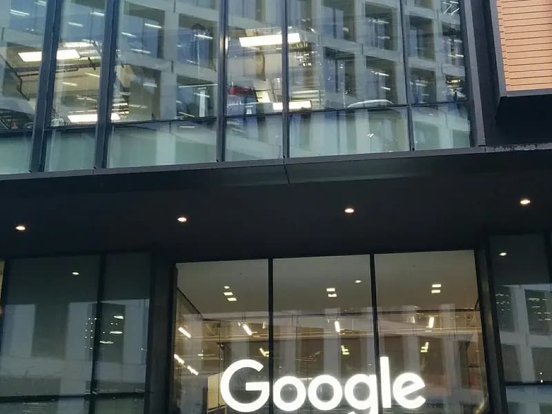 The glass front of Google's building at 6 Pancras Square in London, home to Google DeepMind, with the Google name lit above the entrance, photographed on 21 December 2017, a file photograph of the building and not of Genie 4