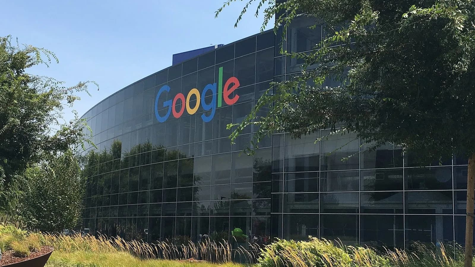 The curved glass facade of a Google building with the company's logo at the Googleplex in Mountain View, California, photographed on 27 July 2016, a file photograph and not related to the launch event