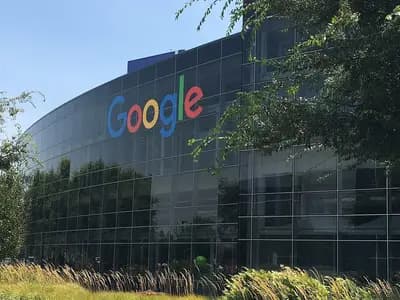 The curved glass facade of a Google building with the company's logo at the Googleplex in Mountain View, California, photographed on 27 July 2016, a file photograph and not related to the launch event