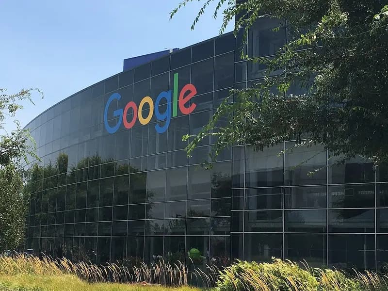 The curved glass facade of a Google building with the company's logo at the Googleplex in Mountain View, California, photographed on 27 July 2016, a file photograph and not related to the launch event