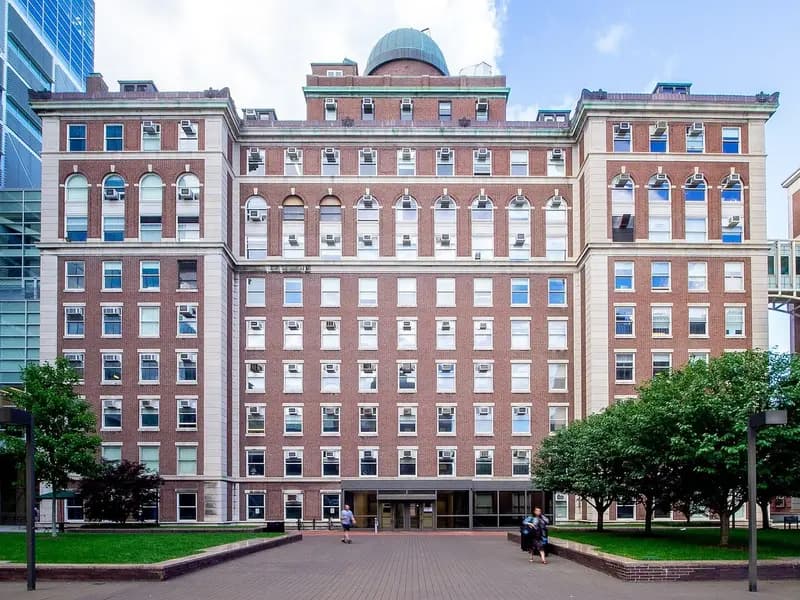 The red brick and limestone Pupin Hall, home of Columbia University's physics department, rising behind green lawns and a paved plaza, photographed on 30 June 2019, a file photograph of the building and not of the research