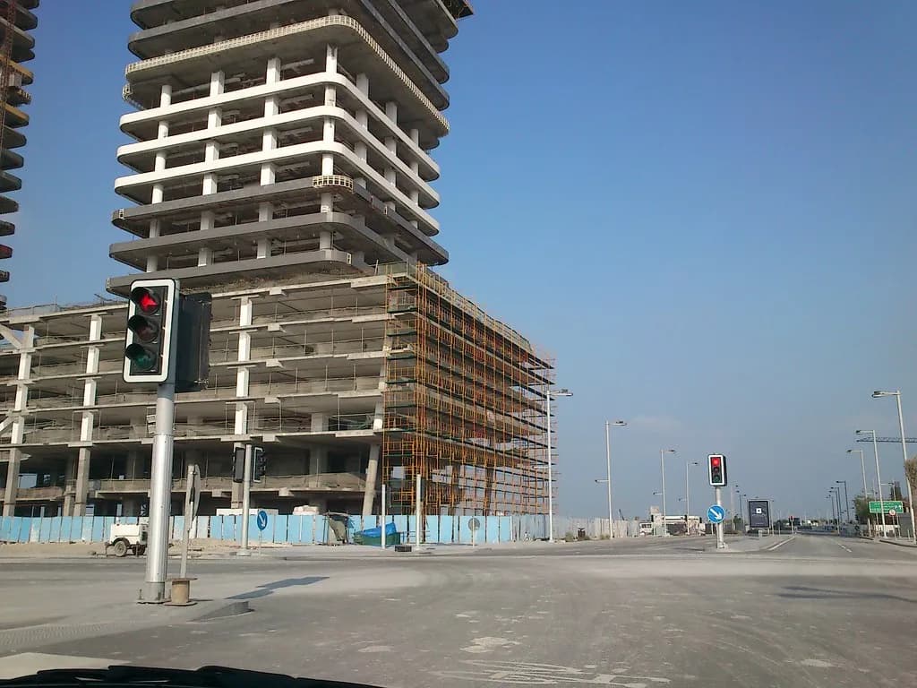 A modern GCC architectural project showing cutting-edge skyscraper design against desert landscape