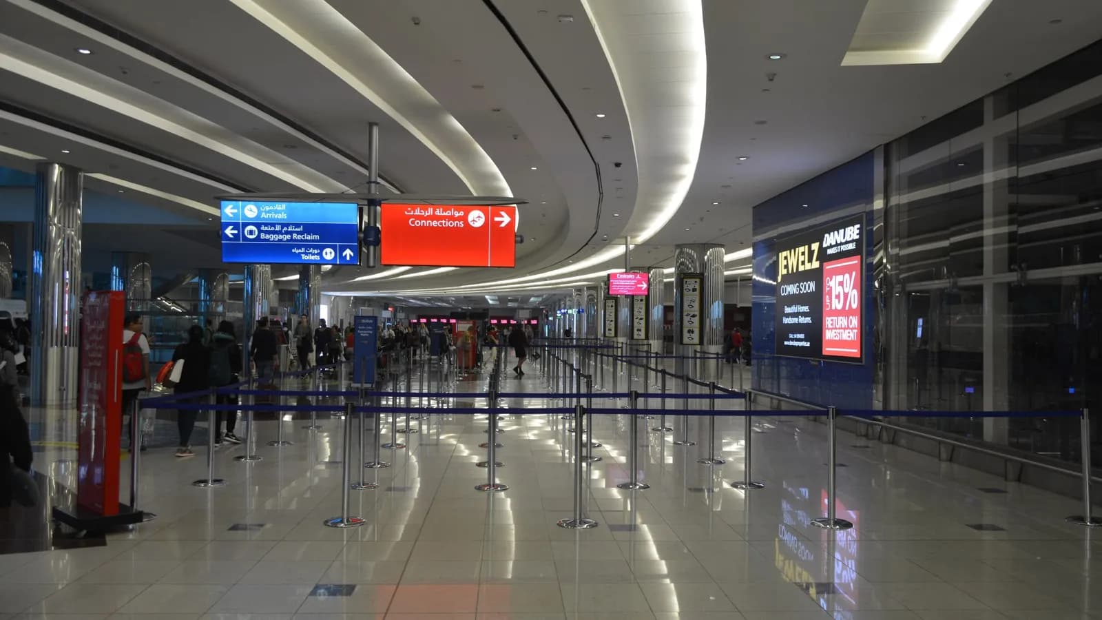 Empty queuing lanes in the Concourse B lobby at Dubai International Airport