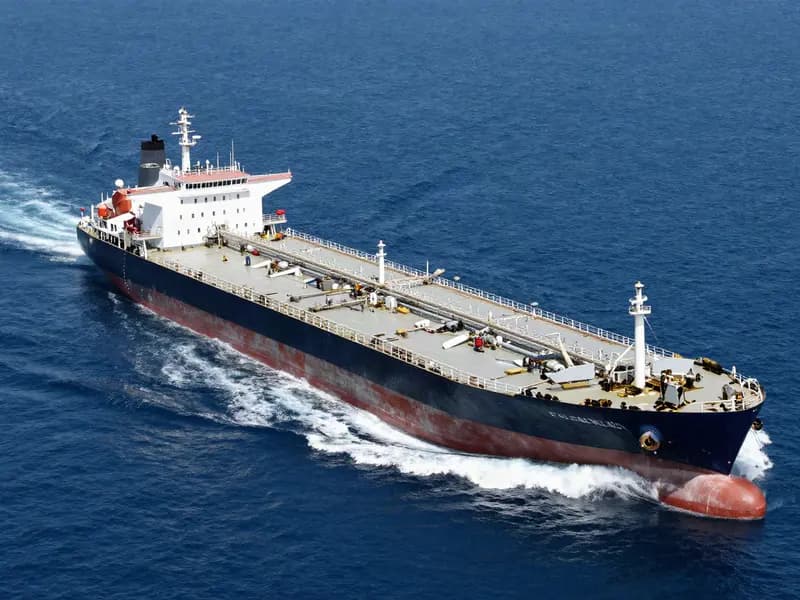 A loaded oil tanker under way on open blue water