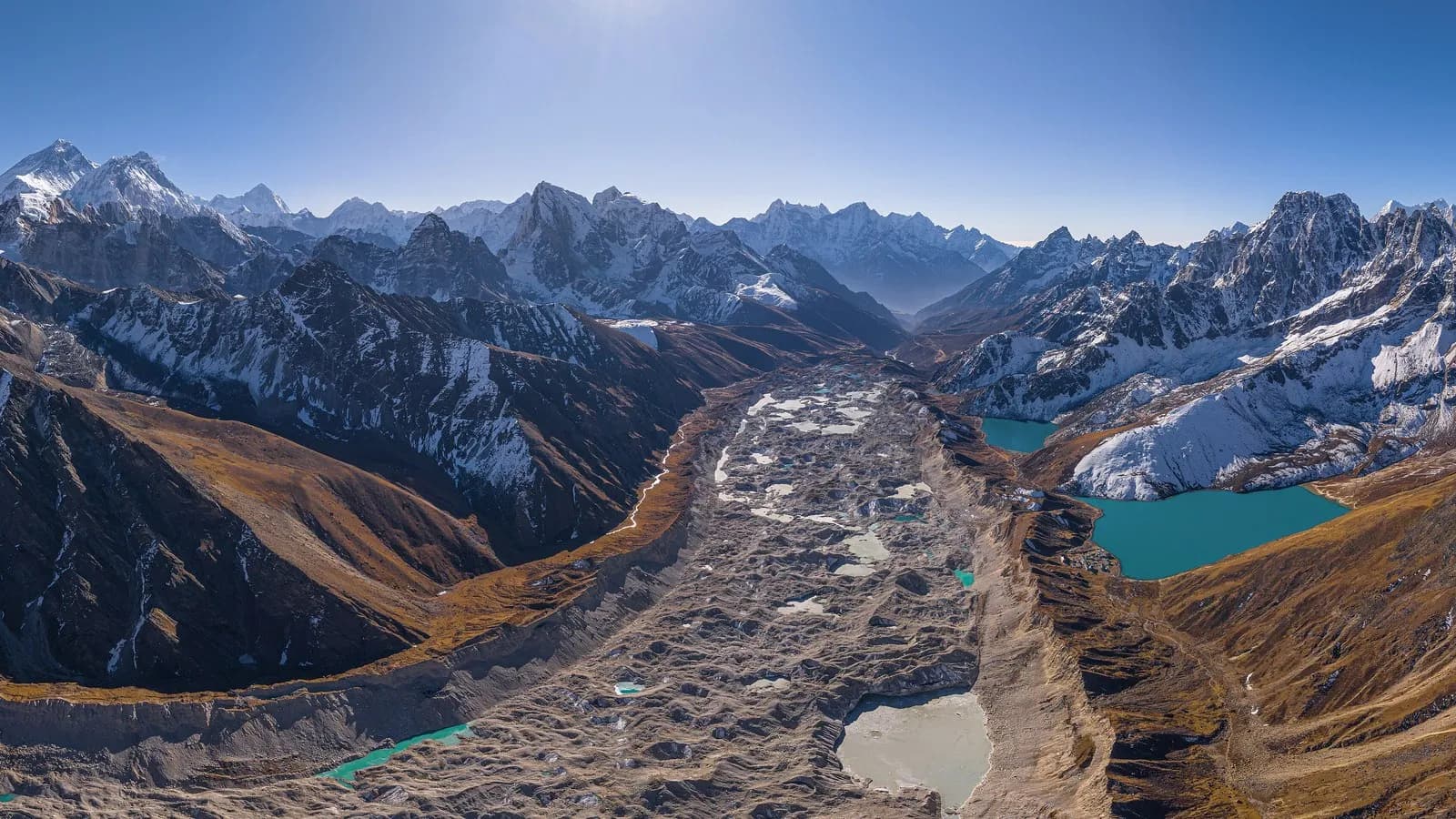 The Ngozumpa glacier and the Gokyo lakes below the peaks of the Khumbu region in Nepal, seen from the air in June 2025
