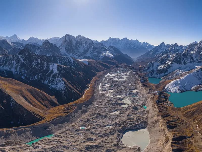 The Ngozumpa glacier and the Gokyo lakes below the peaks of the Khumbu region in Nepal, seen from the air in June 2025