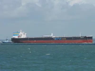 A large crude oil tanker with a tug alongside moving through coastal waters in the Solent, England, photographed on 11 June 2022, a file photograph illustrative of oil tankers and not of any vessel attacked near the Strait of Hormuz