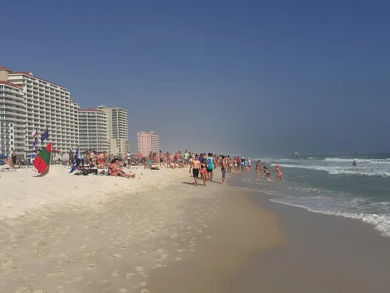 Hotel towers and people on the beach at Gulf Shores, Alabama, photographed in March 2015, a file photograph of a resort town covered by evacuation orders and not of Hurricane Isaias