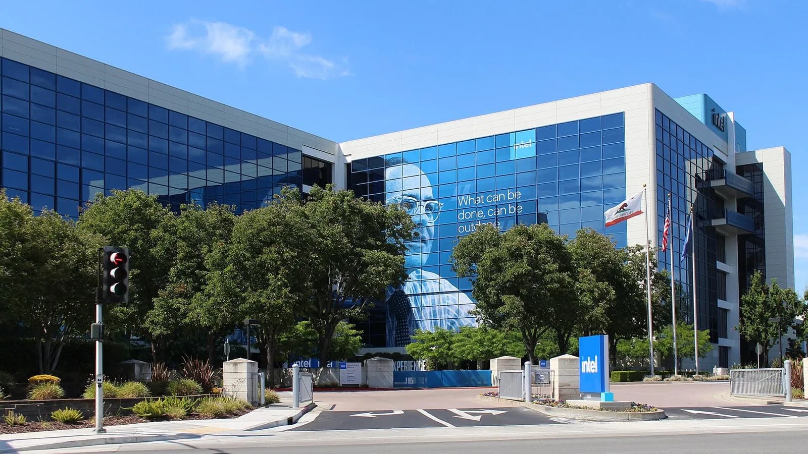The Robert Noyce Building at Intel's headquarters on Mission College Boulevard in Santa Clara, California, a blue glass tower with a banner on its facade and an Intel sign at the entrance, photographed on 2 July 2023, a file photograph of the headquarters and not of this week's results