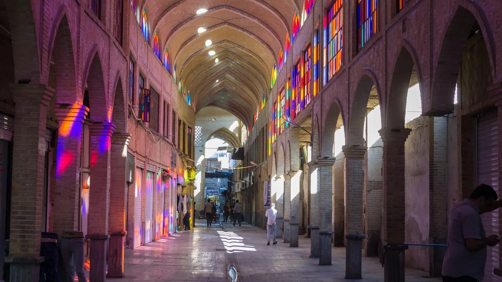 A covered arcade of the Grand Bazaar in Tehran, illustrative of the economy affected by the rial's fall and photographed in August 2015