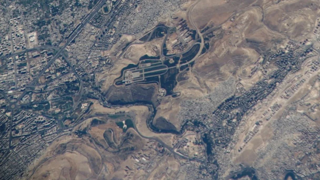 An astronaut's view from the International Space Station of Damascus and the hills and river valley around the Presidential Palace area, photographed on 2 September 2006, a file photograph of the Syrian capital and not of this week's meeting