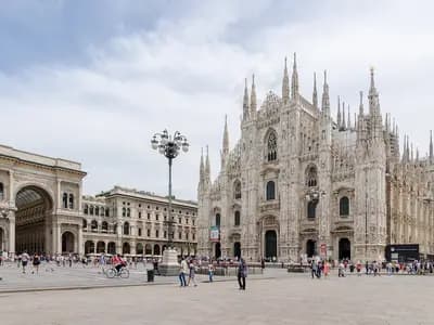 Milan Cathedral and the Piazza del Duomo with the arch of the Galleria Vittorio Emanuele II on the left and visitors crossing the square, photographed on 27 June 2016, a file photograph of the square and not from Saturday's protest