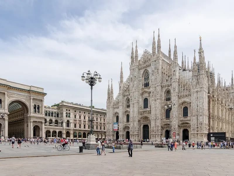 Milan Cathedral and the Piazza del Duomo with the arch of the Galleria Vittorio Emanuele II on the left and visitors crossing the square, photographed on 27 June 2016, a file photograph of the square and not from Saturday's protest