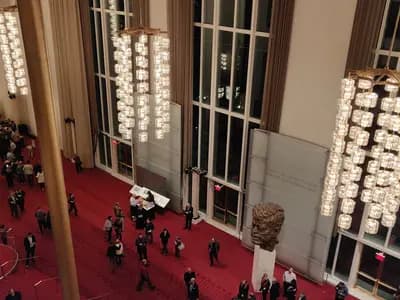 Patrons in the Grand Foyer of the Kennedy Center during an opera intermission in December 2019, under the Orrefors chandeliers, before the ceiling gave way