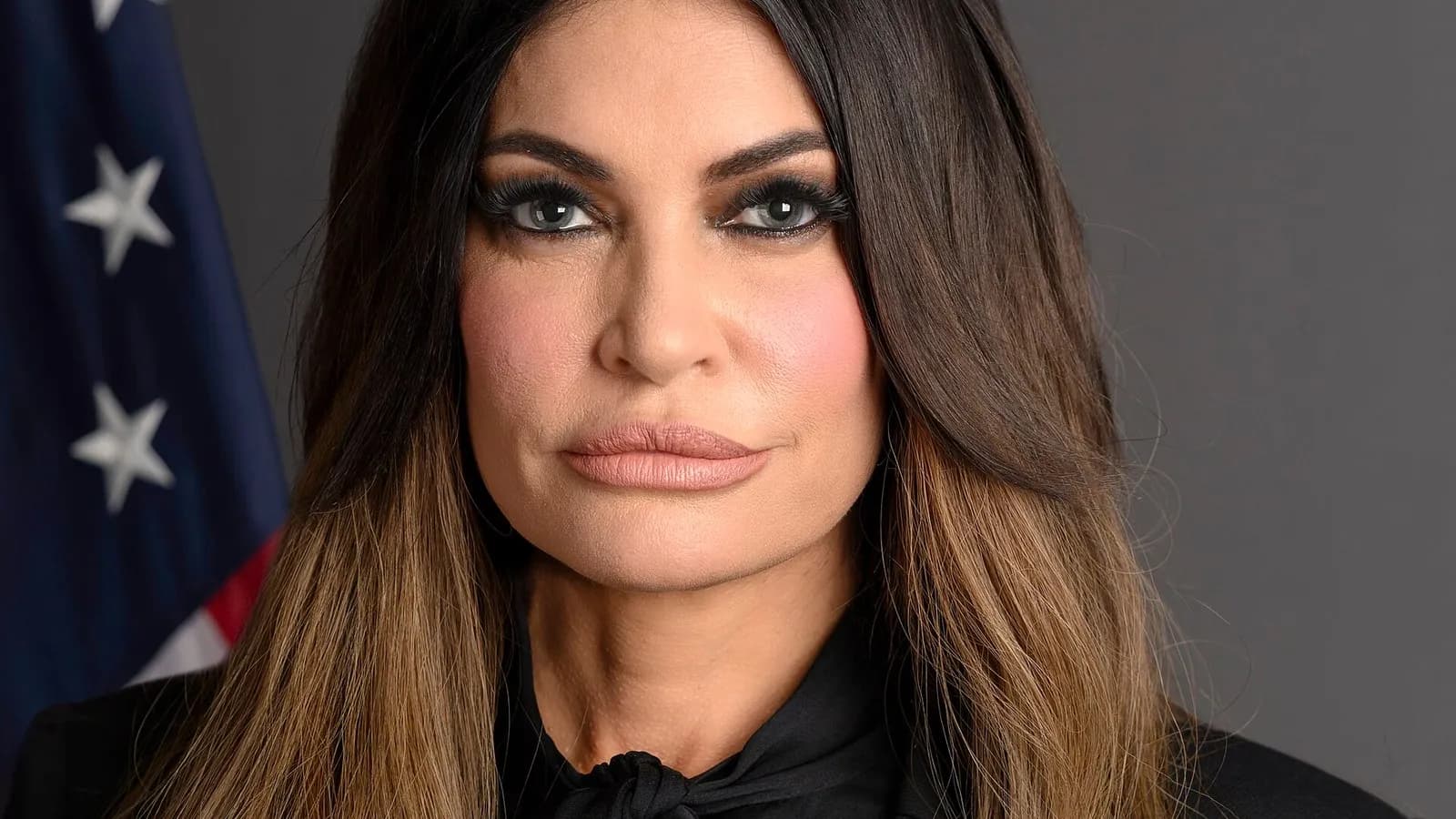 The official portrait of Kimberly Guilfoyle as US ambassador to Greece, in front of an American flag, published by the US Embassy in Athens in November 2025, a file photograph and not from this week
