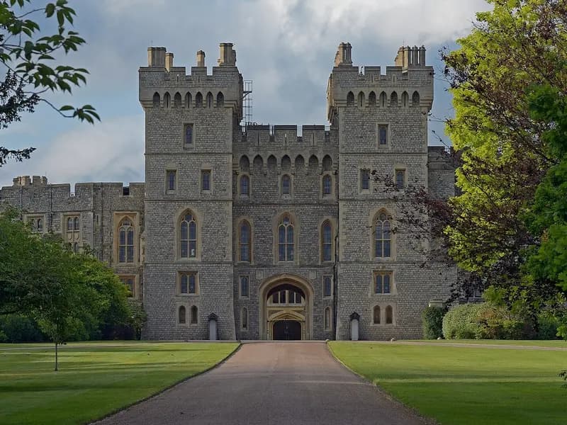 The King George IV Gate and towers of Windsor Castle seen along a tree-lined path, photographed on 4 June 2019, a file photograph of the castle and not from Tuesday's banquet