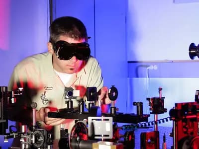 A laser optics setup at Idaho National Laboratory, illustrative of the kind of photonics apparatus used in entanglement research and not the Kyoto team's own circuit, photographed in August 2007