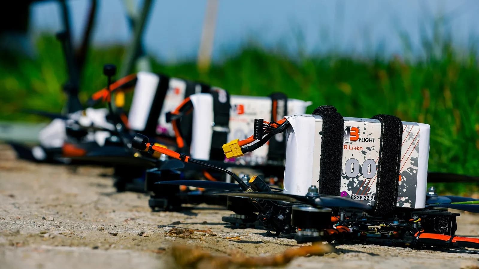 Small quadcopters staged on the ground during a United States Army exercise. These are test aircraft photographed elsewhere, not the drone recovered at Leipzig