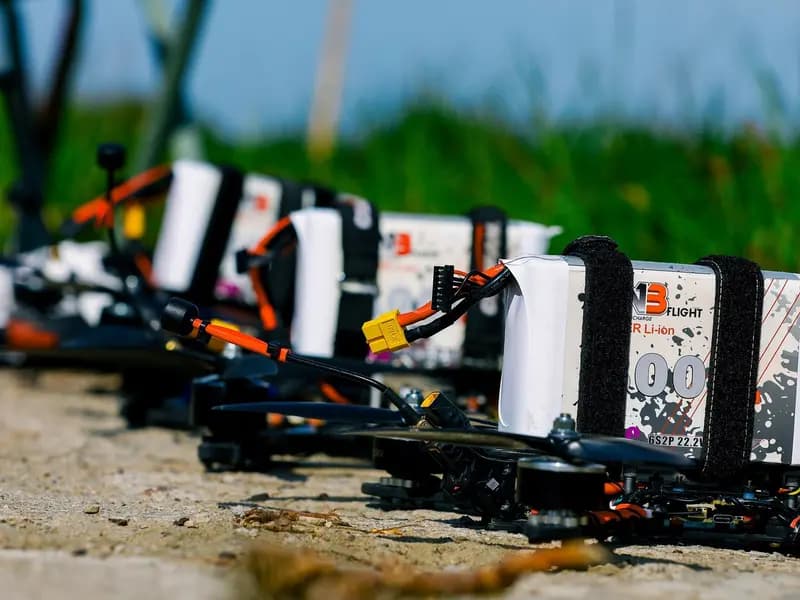 Small quadcopters staged on the ground during a United States Army exercise. These are test aircraft photographed elsewhere, not the drone recovered at Leipzig