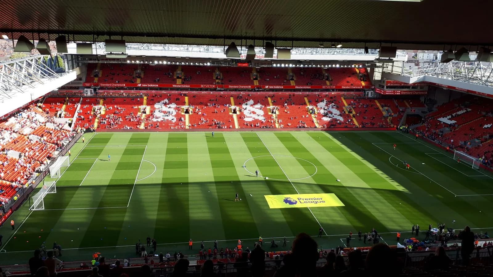 The pitch and stands at Anfield, Liverpool, with red seats and the Premier League logo on the grass, photographed on 25 August 2018, a file photograph of the ground and not from Tuesday's match