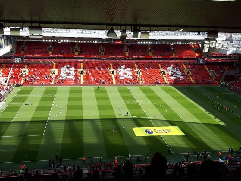 The pitch and stands at Anfield, Liverpool, with red seats and the Premier League logo on the grass, photographed on 25 August 2018, a file photograph of the ground and not from Tuesday's match