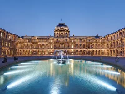 The Cour Carree of the Louvre in Paris at dusk, photographed on 2 April 2009, a file photograph and not from Tuesday's Louis Vuitton show